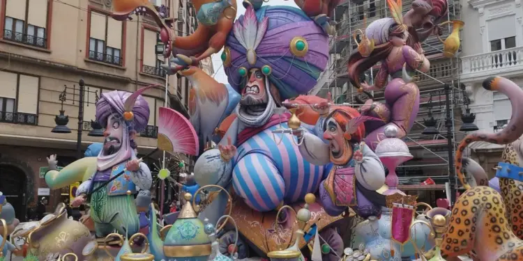 Arabian Nights themed falla monument with giant turbaned ninots in a street in central Valencia during Las Fallas